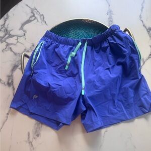 Vibrant Blue Athletic Shorts with Teal Accents